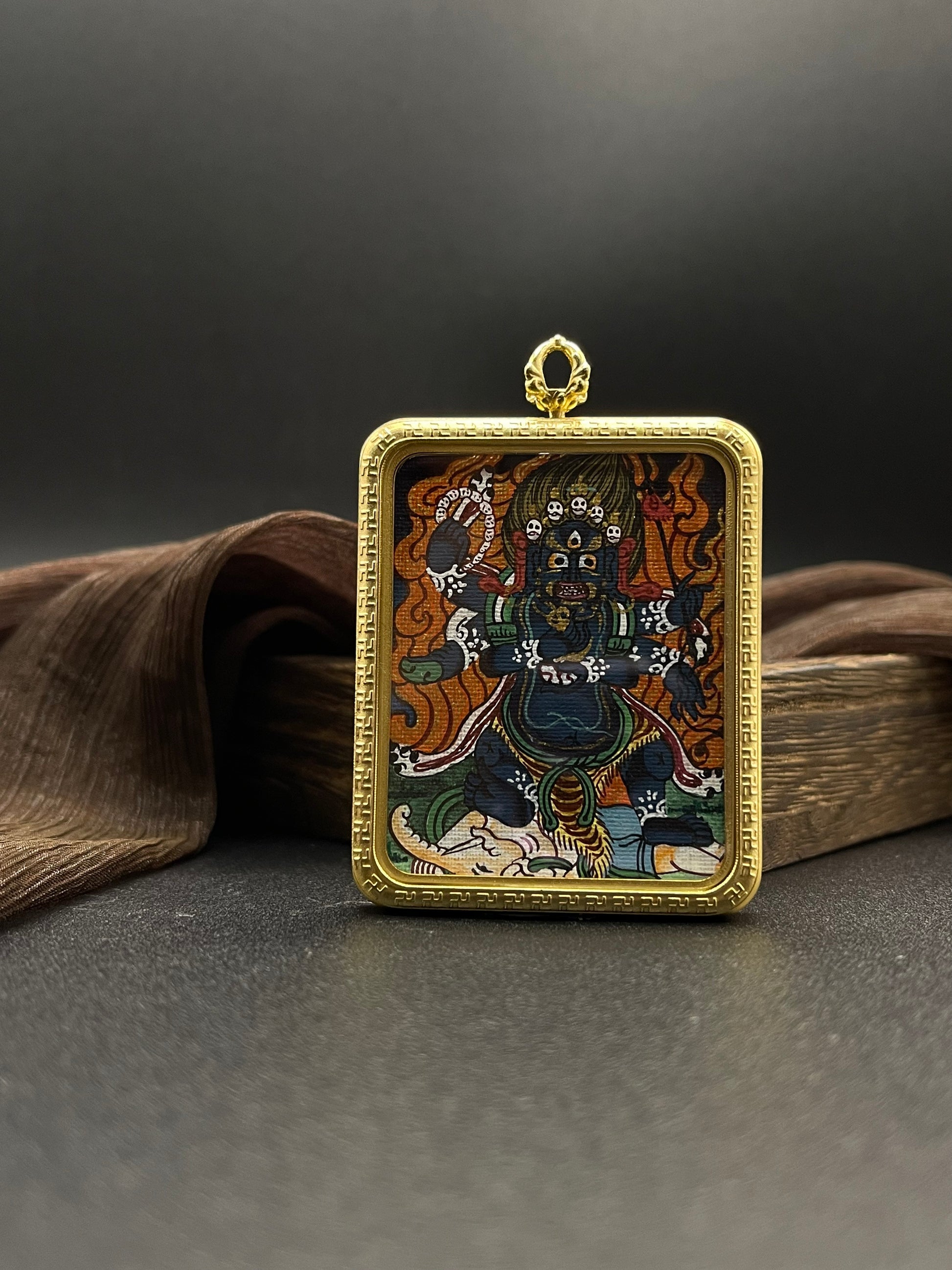  Detailed view of the titanium casing for the Mahakala Thangka pendant, symbolising protection and tradition in Buddhist practice