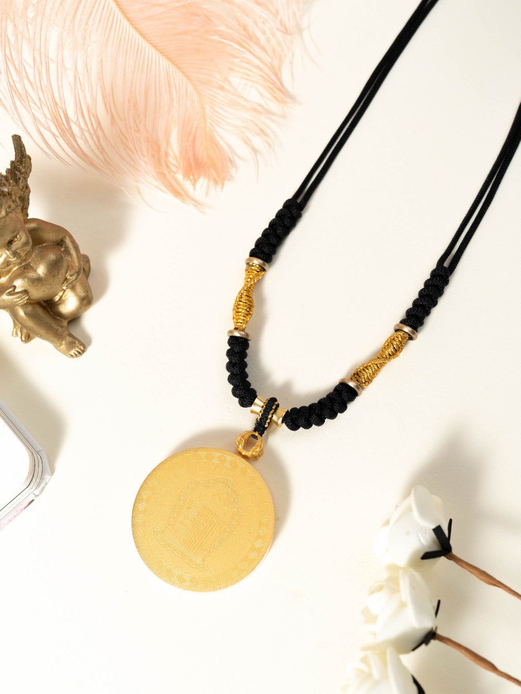 The Rekong Six-Armed Mahakala Thangka pendant with hand-braided cord displayed as a sacred amulet for pacify disaster, increase fortune and flourishing endeavour, embodying Buddhist tradition.
