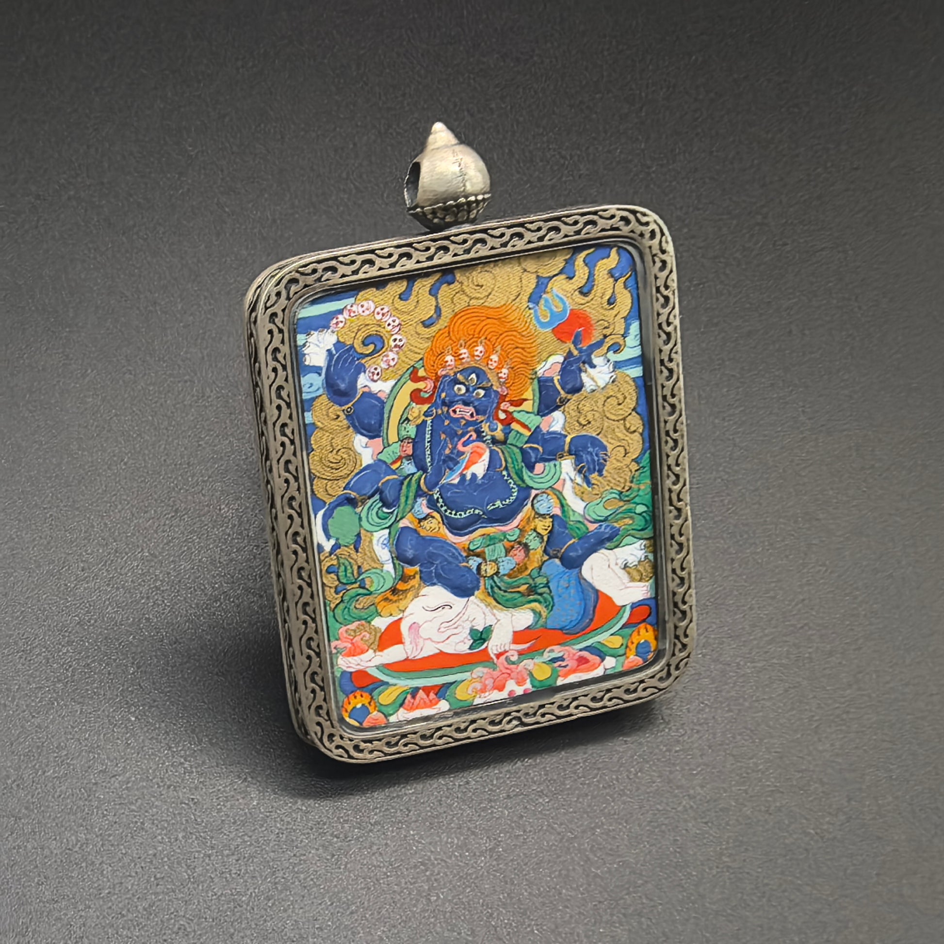  Close-up detail of the Rekong Cuiying Mahakala Thangka painting showing natural mineral pigments.
