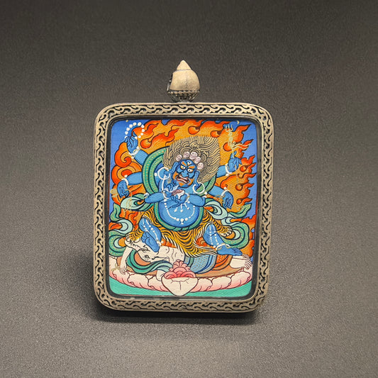 Close-up detail of the Rekong Mahakala Thangka painting showing natural mineral pigments, showcasing the masterful artistry of Rekong lama painters.
