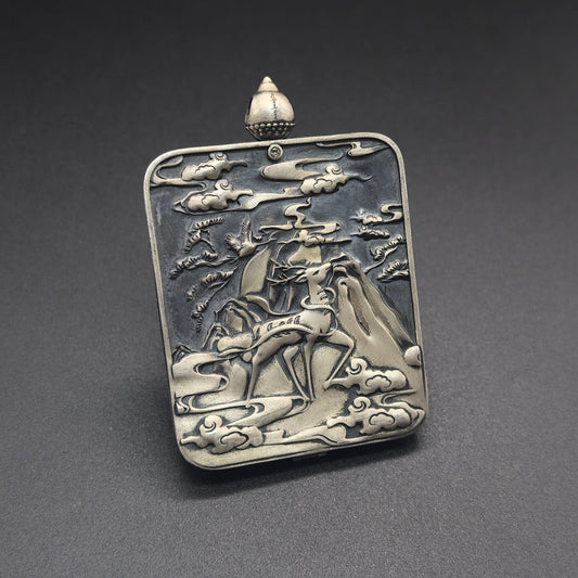 The Rekong Mahakala Thangka pendant with 925 silver casing displayed as a sacred amulet for protection and fortune, embodying Buddhist tradition.
