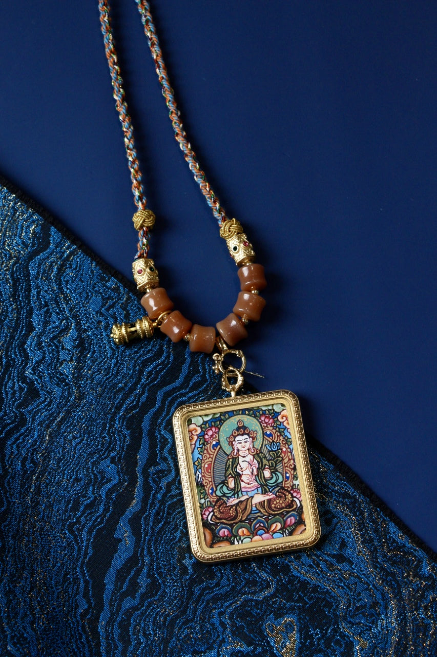 Mahasthamaprapta Bodhisattva Thangka Amulet, a powerful symbol of compassion and wisdom in Tibetan Buddhist tradition.
