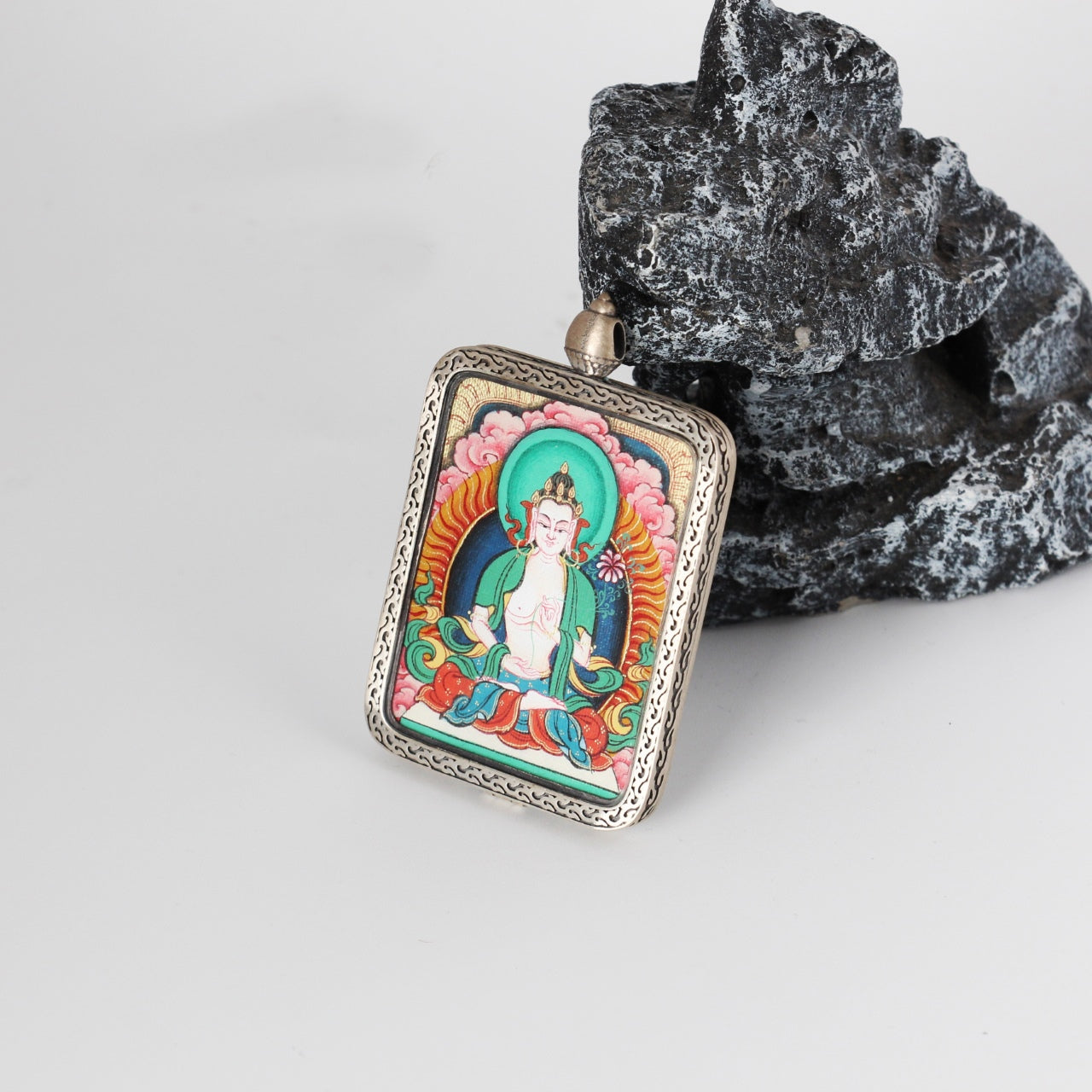  The Karma Kagyu Mahasthamaprapta Thangka pendant displayed as a sacred amulet for wisdom and strength, embodying Tibetan Buddhist tradition.

