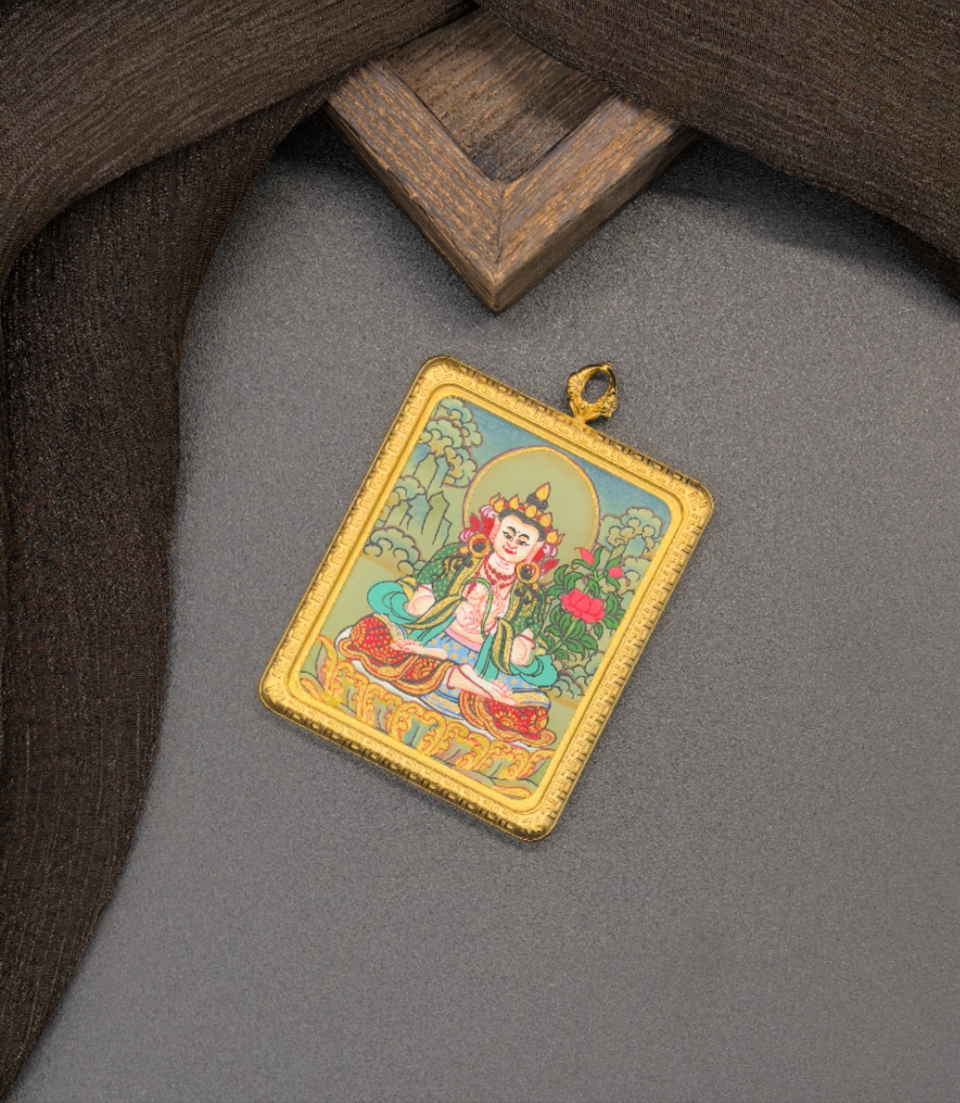  The Nepal Mahasthamaprapta Thangka pendant with titanium casing displayed as a sacred amulet for wisdom and success, embodying Buddhist tradition.

