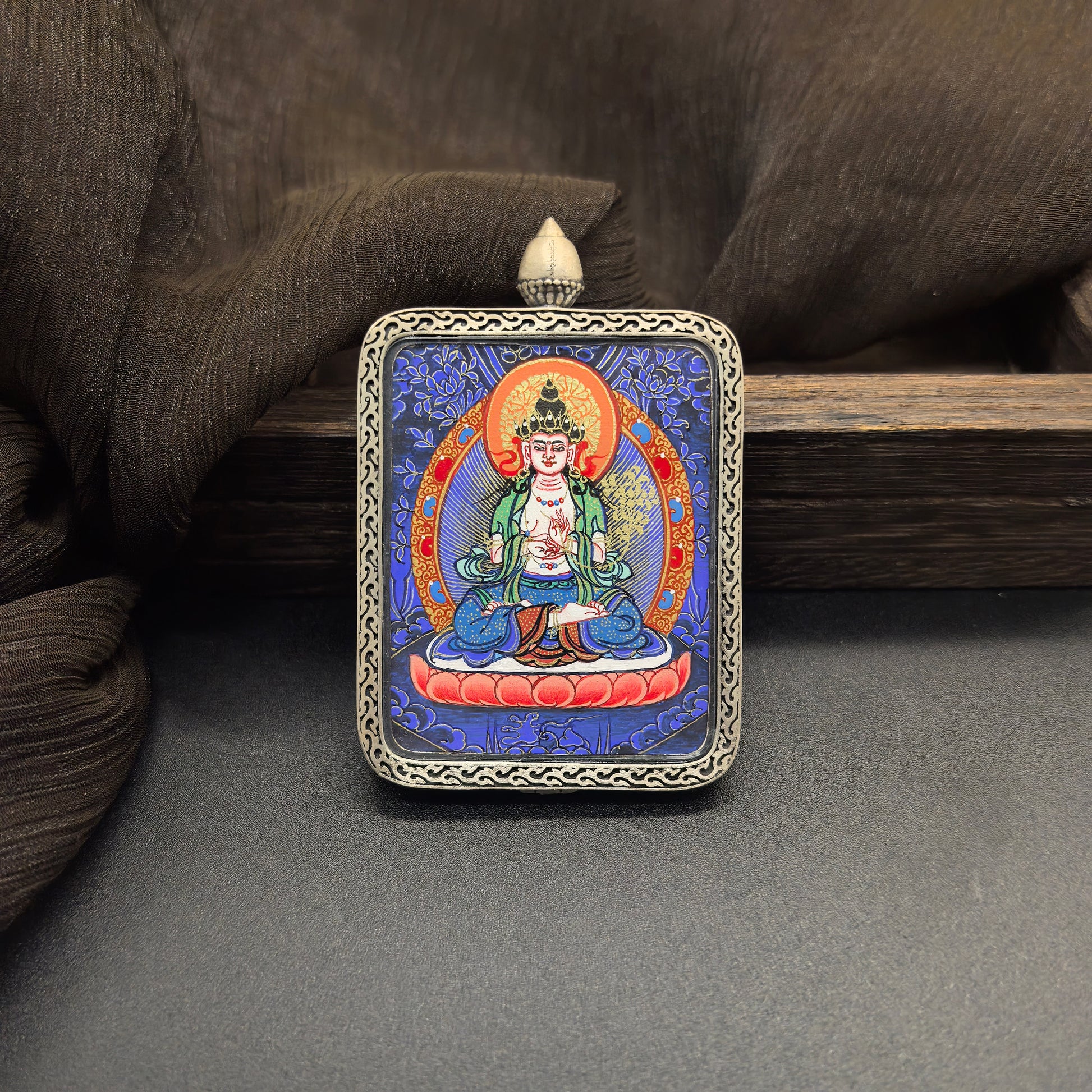  Close-up detail of the Rekong Blue Thangka Mahasthamaprapta painting showing natural mineral pigments, showcasing the masterful artistry of Rekong lama painters.

