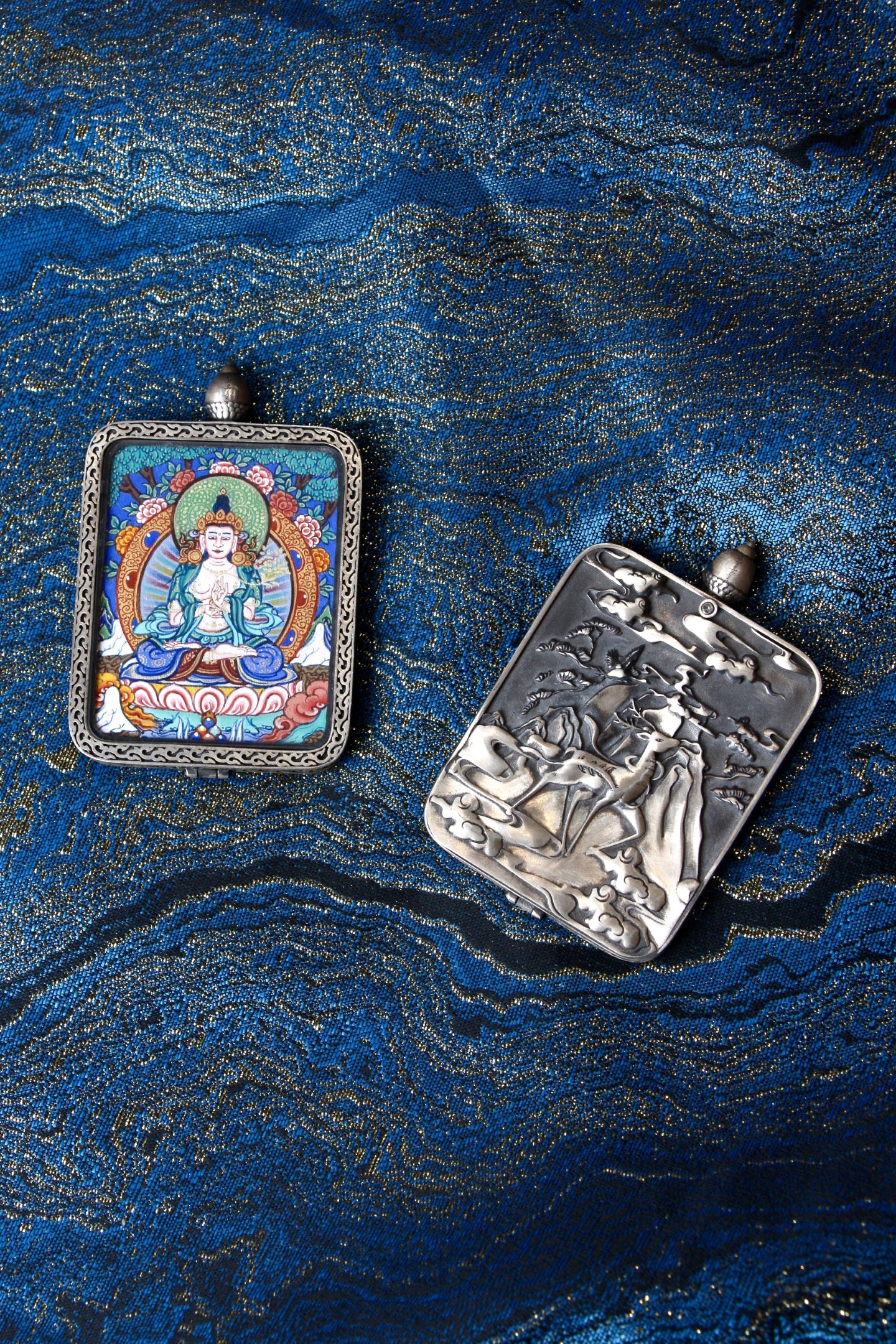 Close-up of the S925 sterling silver case with Dunhuang Nine-Colored Deer engraving, protecting the Mahasthamaprapta Thangka.