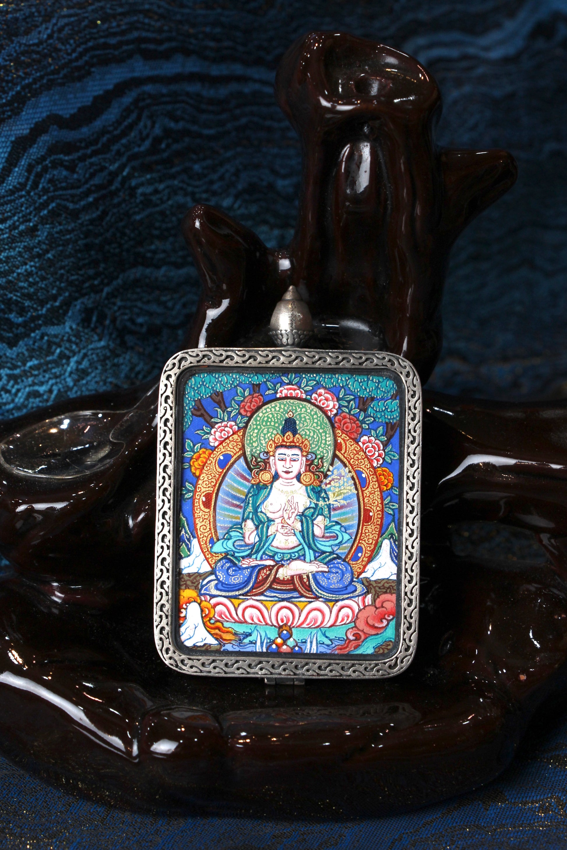 A sacred hand-painted Mahasthamaprapta Bodhisattva Thangka pendant from Regong, featuring the Bodhisattva of Great Strength in a fine silver frame.