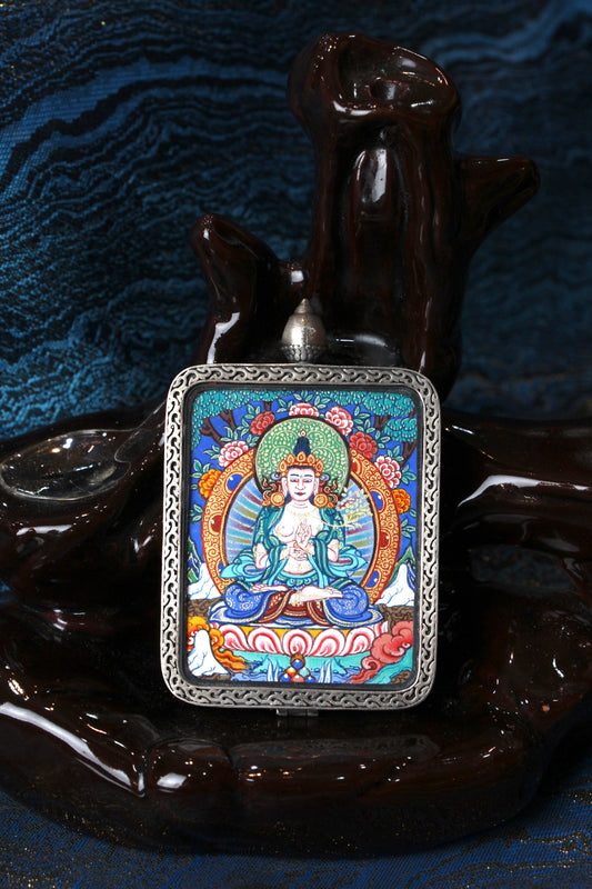 A sacred hand-painted Mahasthamaprapta Bodhisattva Thangka pendant from Regong, featuring the Bodhisattva of Great Strength in a fine silver frame.