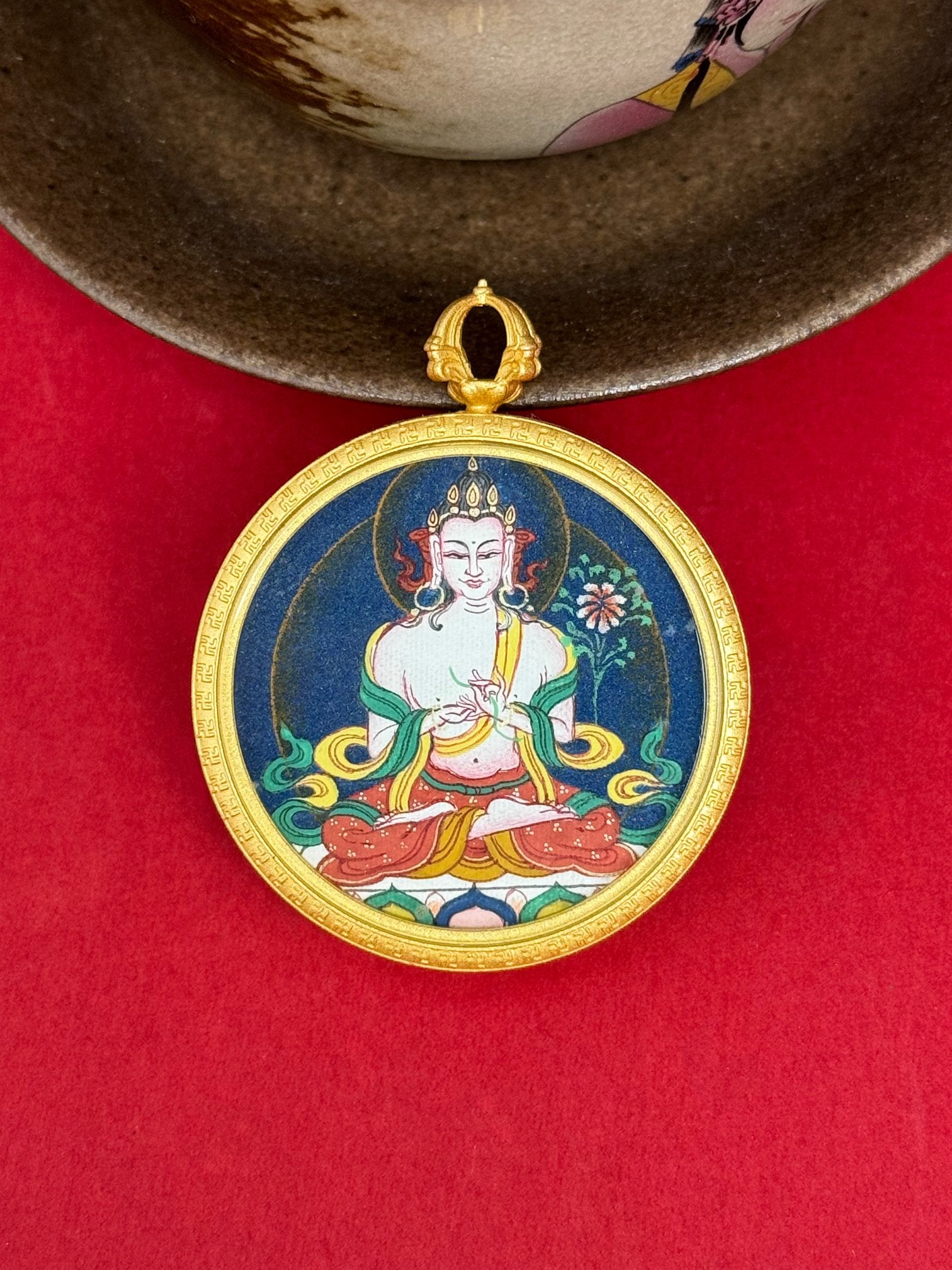 Close-up detail of the Tibet Bold Mahasthamaprapta Thangka showing hand-painted mineral pigments, gold and lapis, showcasing the masterful artistry and three-dimensional imagery.
