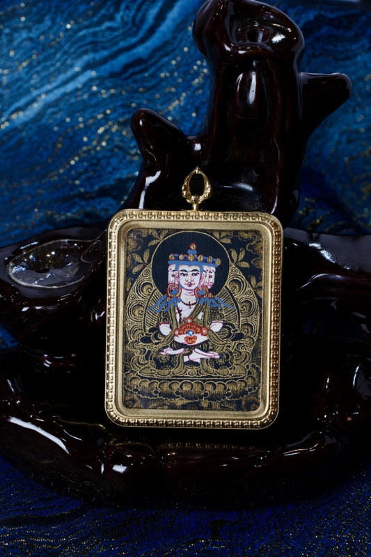 Vairocana Buddha thangka pendant depicting the central cosmic Buddha in Tibetan Buddhist culture, symbolizing ultimate truth and enlightenment.