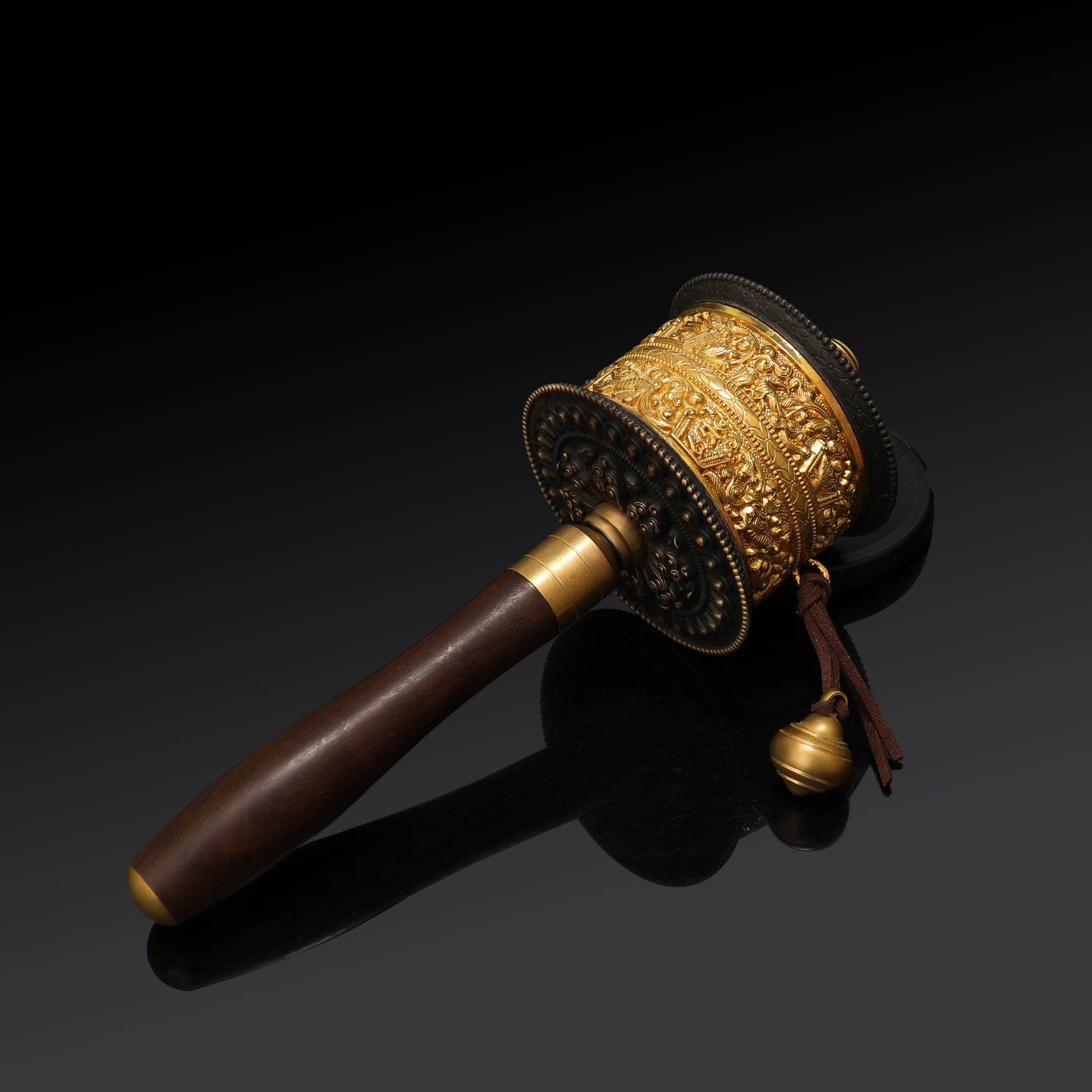 Rotating Tibetan Mani prayer wheel in motion, representing continuous prayer and spiritual practice