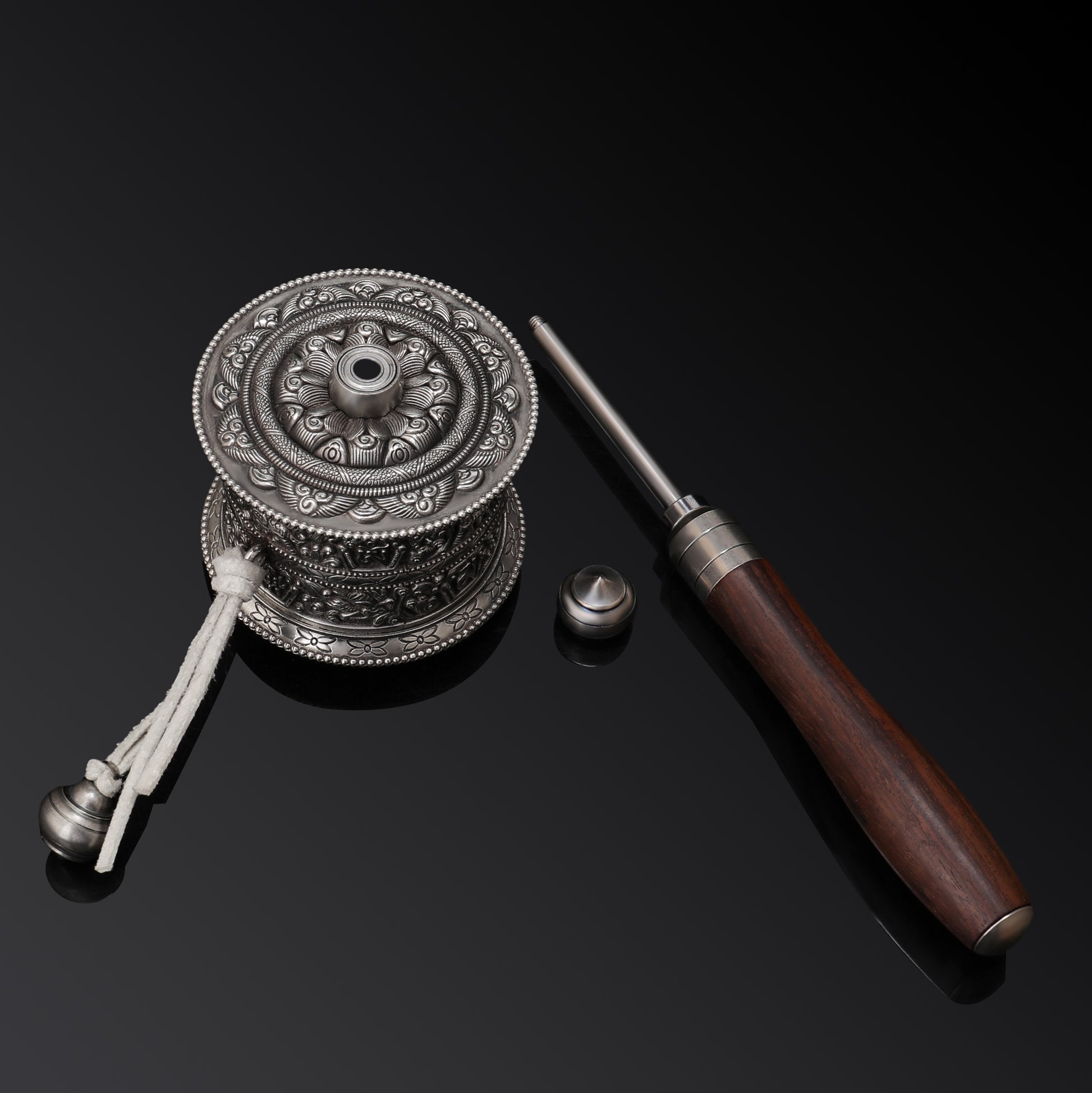 Colorful Tibetan Mani wheel with vibrant traditional designs used in Buddhist rituals