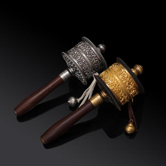 Handheld Tibetan Buddhist Mani prayer wheel, used for devotional spinning and mantra recitation