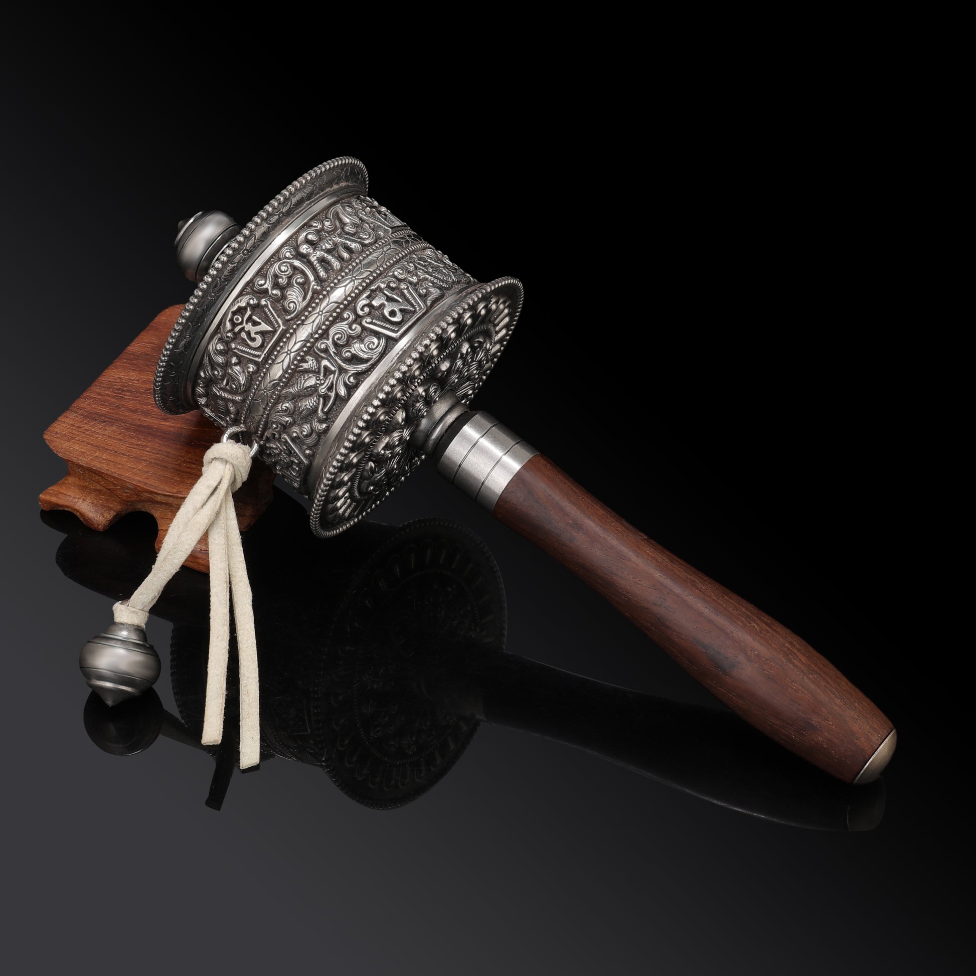 Handcrafted wooden Tibetan Mani prayer wheel, showcasing traditional artisan techniques