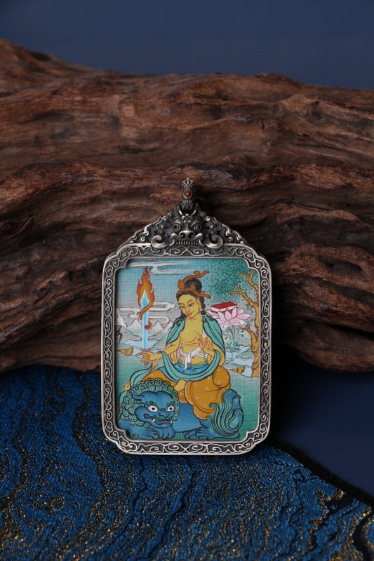 Tibetan thangka amulet featuring Manjushri Bodhisattva, revered for transcendent wisdom and clarity in Tibetan Buddhism.