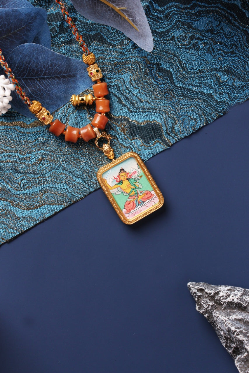  Close-up detail of the Karma Kagyu Manjushri Thangka painting showing intricate natural mineral pigment work and wisdom symbolism, showcasing the masterful artistry of Tibetan lineage painters.