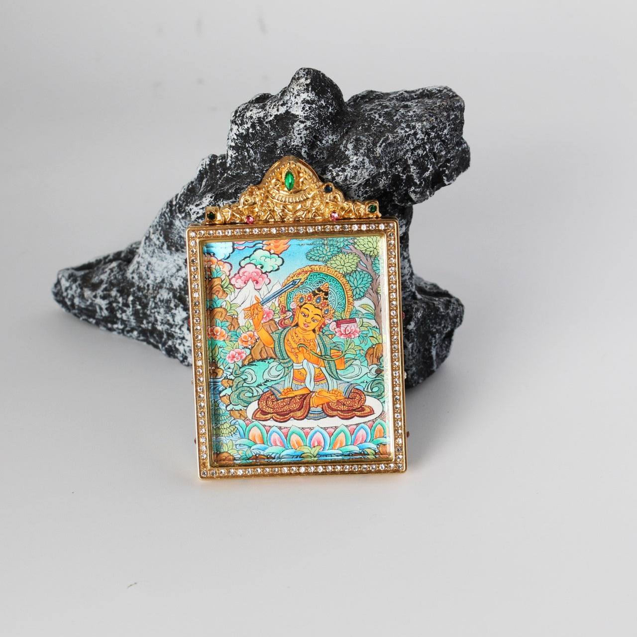  The Nepal Premium Manjushri Thangka pendant displayed as a sacred amulet for wisdom and success, embodying Tibetan Buddhist tradition.
