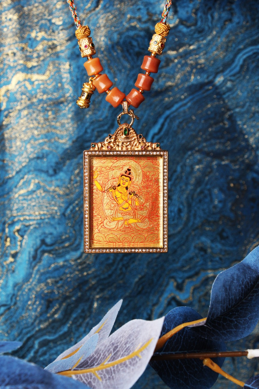  The Rebgong Manjushri Thangka pendant displayed as a sacred amulet for wisdom and learning, embodying the sword of wisdom of Tibetan Buddhist tradition.

