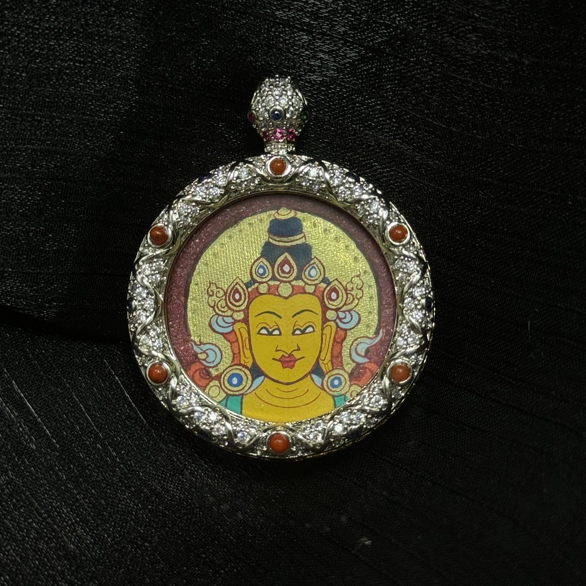 A 3x3cm hand-painted Rekong Red-Gold Manjushri Buddha Head Thangka pendant featuring the Bodhisattva of Wisdom, representing wisdom and blessing in Buddhist tradition.
