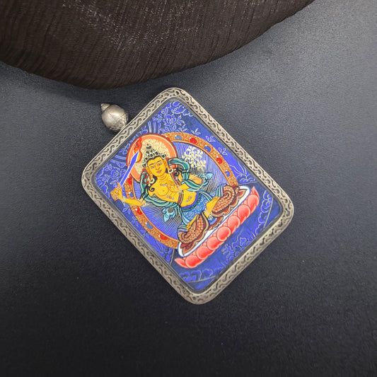 A 3.5x4.5cm hand-painted Rekong Blue Thangka Manjushri (文殊菩萨) Thangka pendant with 925 silver featuring the Mother of all Buddhas and the wisdom deity, representing wisdom and blessing in Buddhist tradition.

