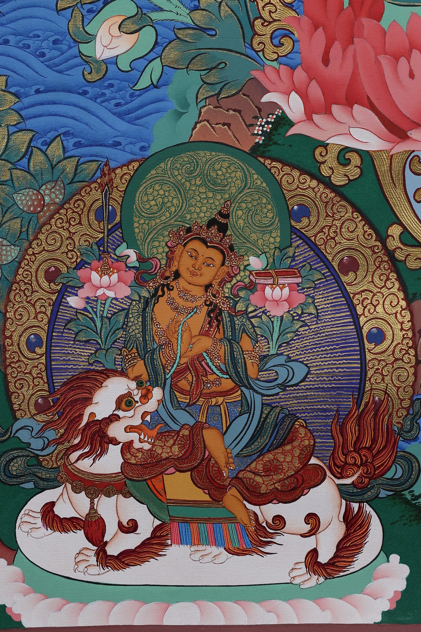 Alt Text: Manjushri holding a lotus with the wisdom scripture, detailed Tibetan Buddhist hand-painted artwork.
