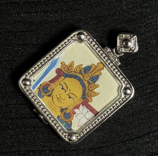  A 2x2cm hand-painted Tibet Manjushri Thangka pendant featuring the Bodhisattva of Wisdom, representing wisdom and success in Buddhist tradition.

