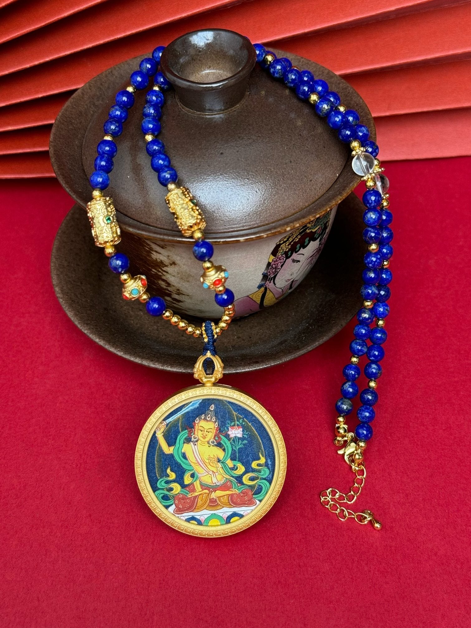 Hand-painted Tibet Bold Manjushri (文殊菩萨) Thangka pendant 3.5cm with copper casing featuring the mother of all Buddhas and wisdom deity, representing wisdom and learning in Buddhist tradition.

