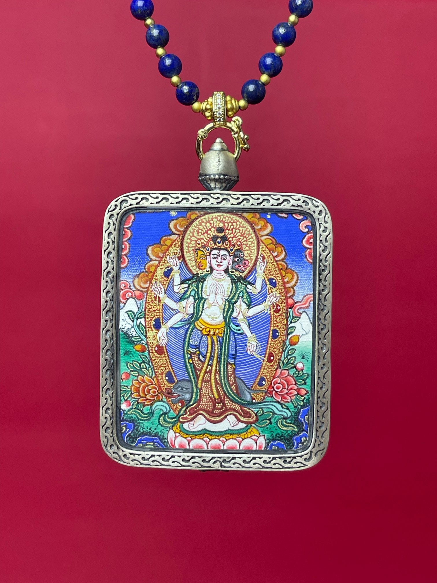 Close-up detail of the Rekong Marici Thangka showing hand-painted mineral pigments, showcasing the Rekong series artistry.

