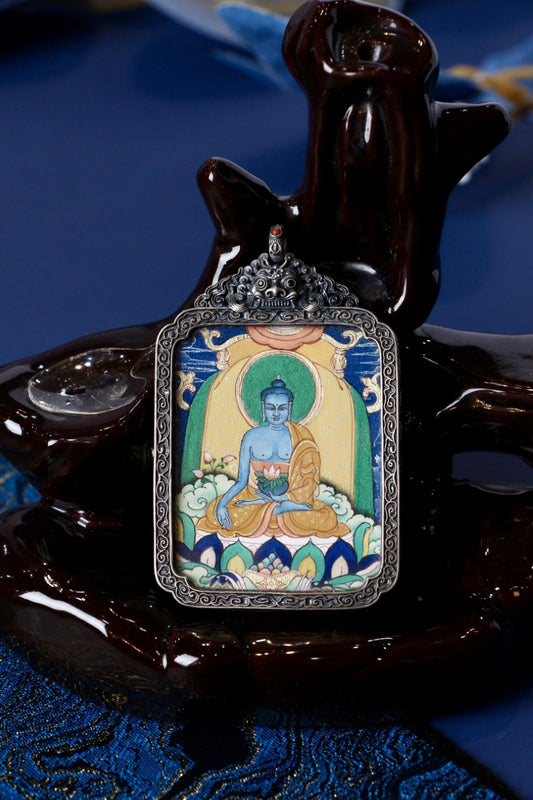 Tibetan thangka jewelry featuring Bhaisajyaguru, inspired by traditional Tibetan Buddhist sacred art.