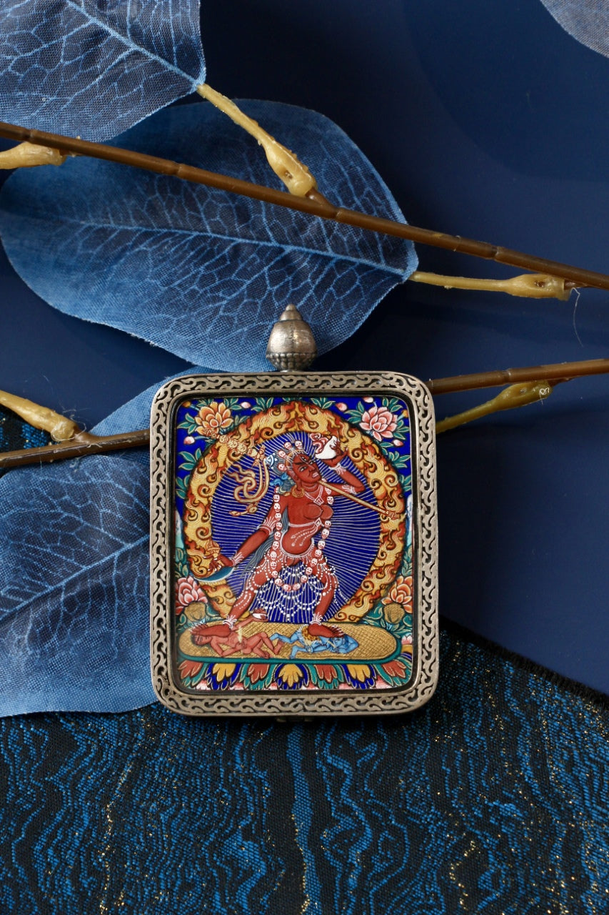 Naro Dakini wrathful thangka pendant symbolizing fierce compassion, tantric wisdom, and the removal of obstacles in Tibetan Buddhism.