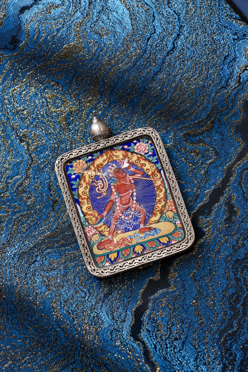 Tibetan thangka jewelry featuring Naro Dakini, inspired by traditional Tibetan Buddhist sacred art and dakini iconography.