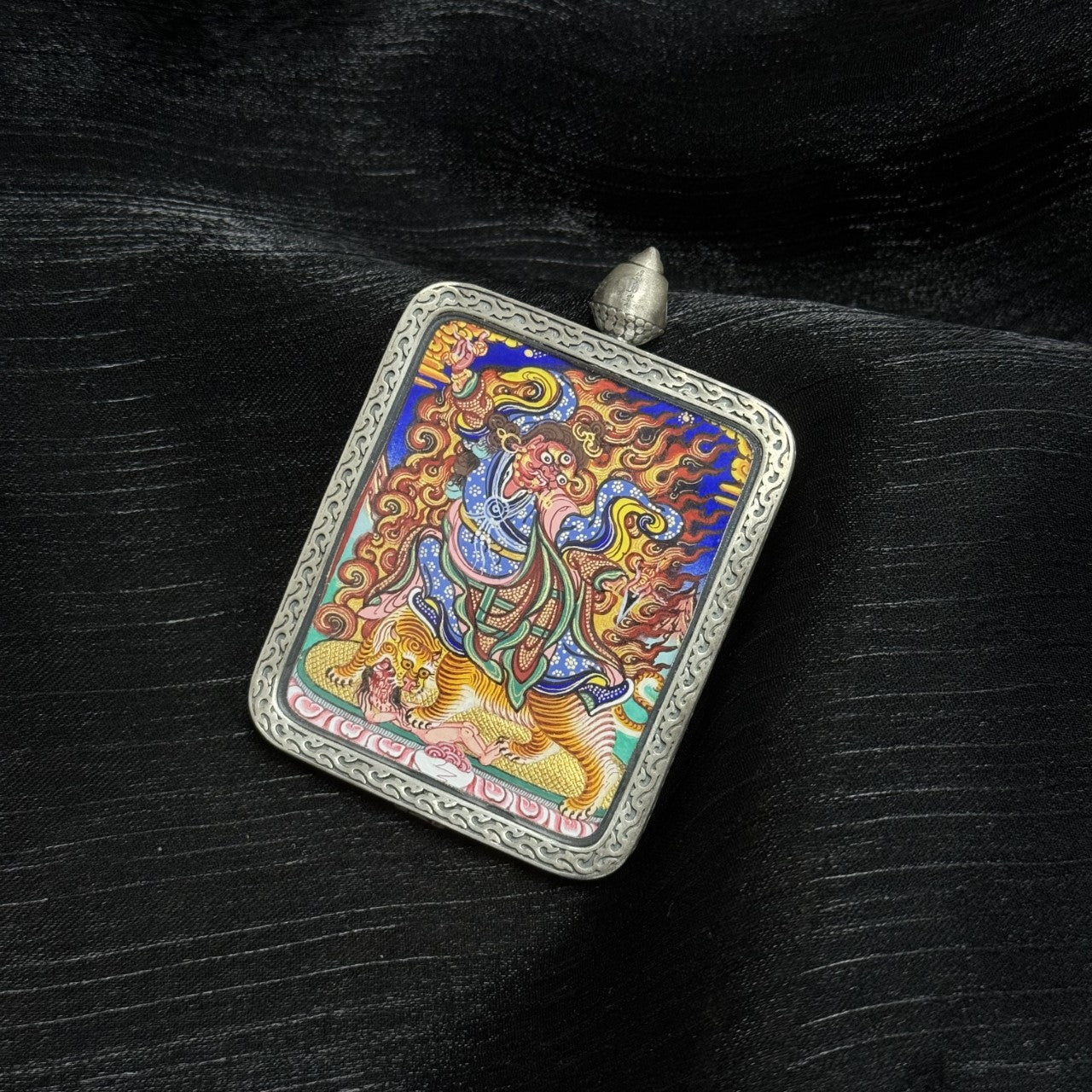  Hand-painted Rebgong Padmasambhava wrathful Thangka pendant featuring the Second Buddha, encased in Dunhuang Nine-Colour Deer silver, representing wisdom and protection in Tibetan Buddhist tradition.
