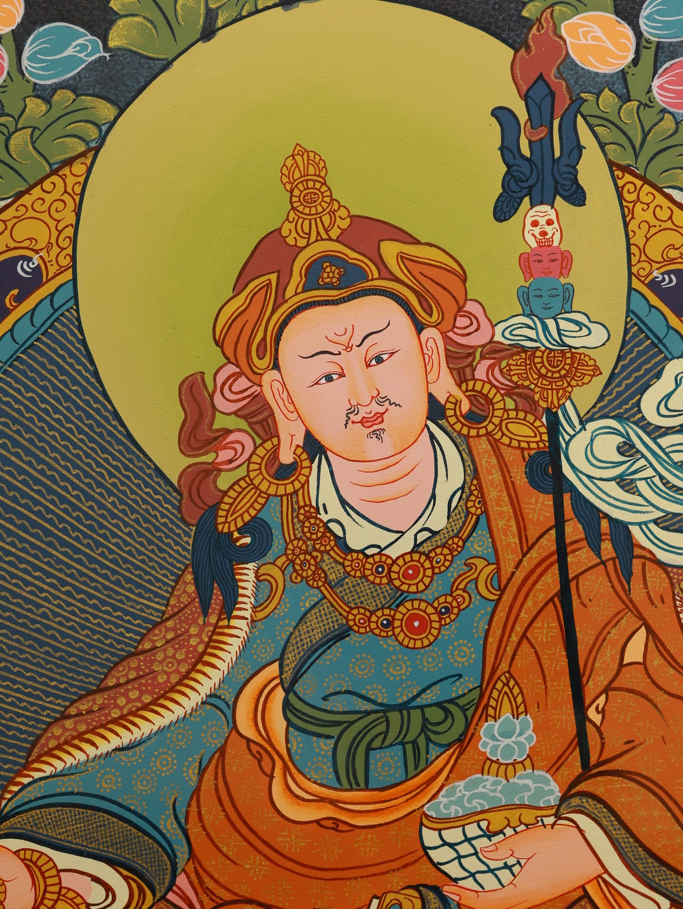 Colorful Padmasambhava deity Thangka, traditional Tibetan sacred painting.