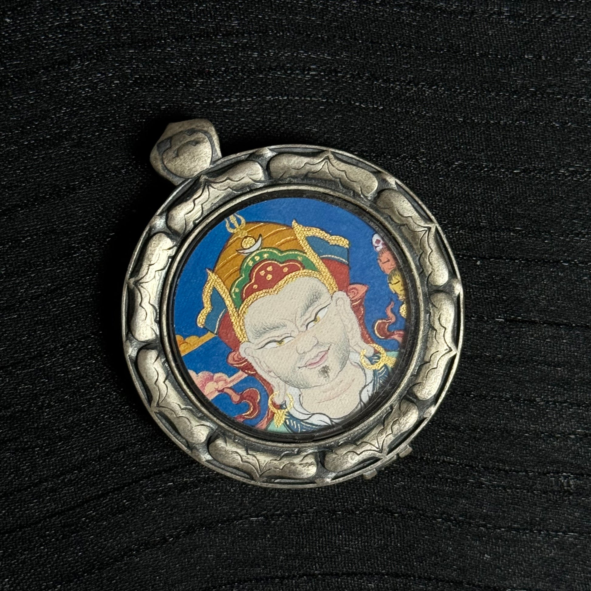 A 2.5x2.5cm hand-painted Tibet Padmasambhava (Guru Rinpoche) Thangka pendant featuring the Second Buddha, representing wisdom and protection in Buddhist tradition.
