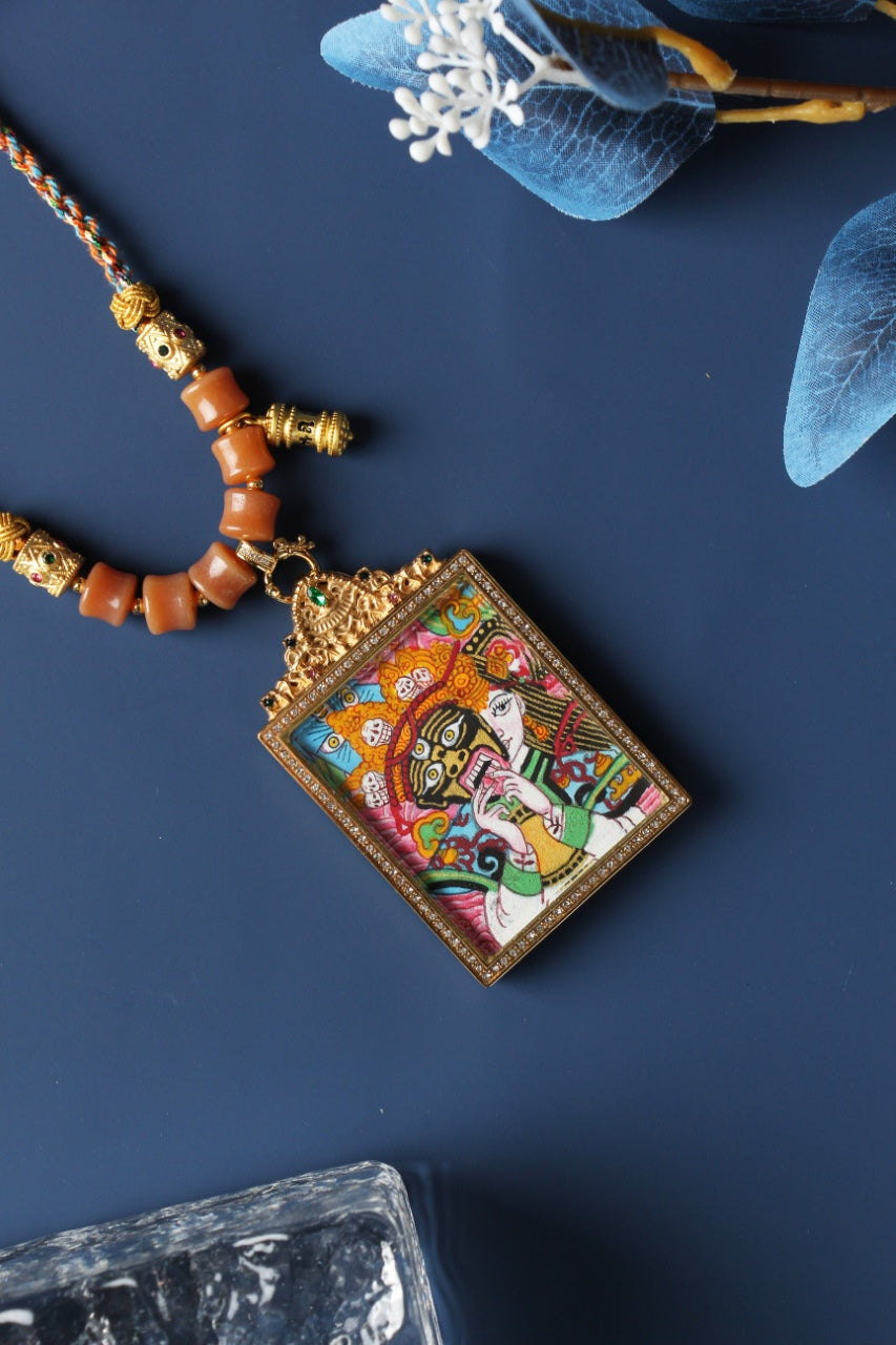 A 3.5x4.5cm hand-painted Tibetan Buddhist Palden Lhamo Thangka pendant featuring the fierce protector goddess of wealth, encased in exclusive 925 Sterling Silver, representing the sacred guardian of prosperity and protection in Tibetan Buddhist culture.

