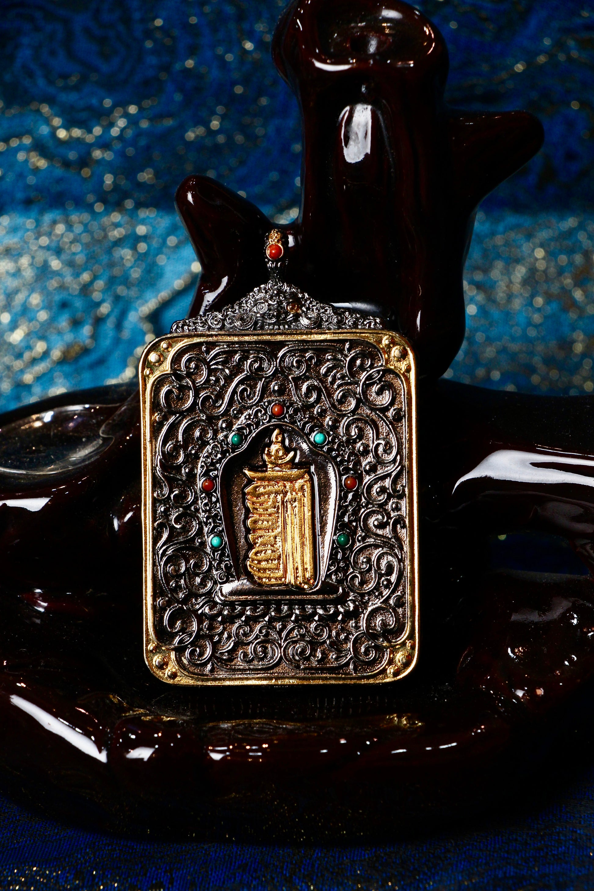 The Rebgong Palden Lhamo Thangka pendant displayed as a sacred protective amulet for wealth, protection, and spiritual practice, embodying the fierce wisdom and compassionate protection of Tibetan Buddhist tradition.

