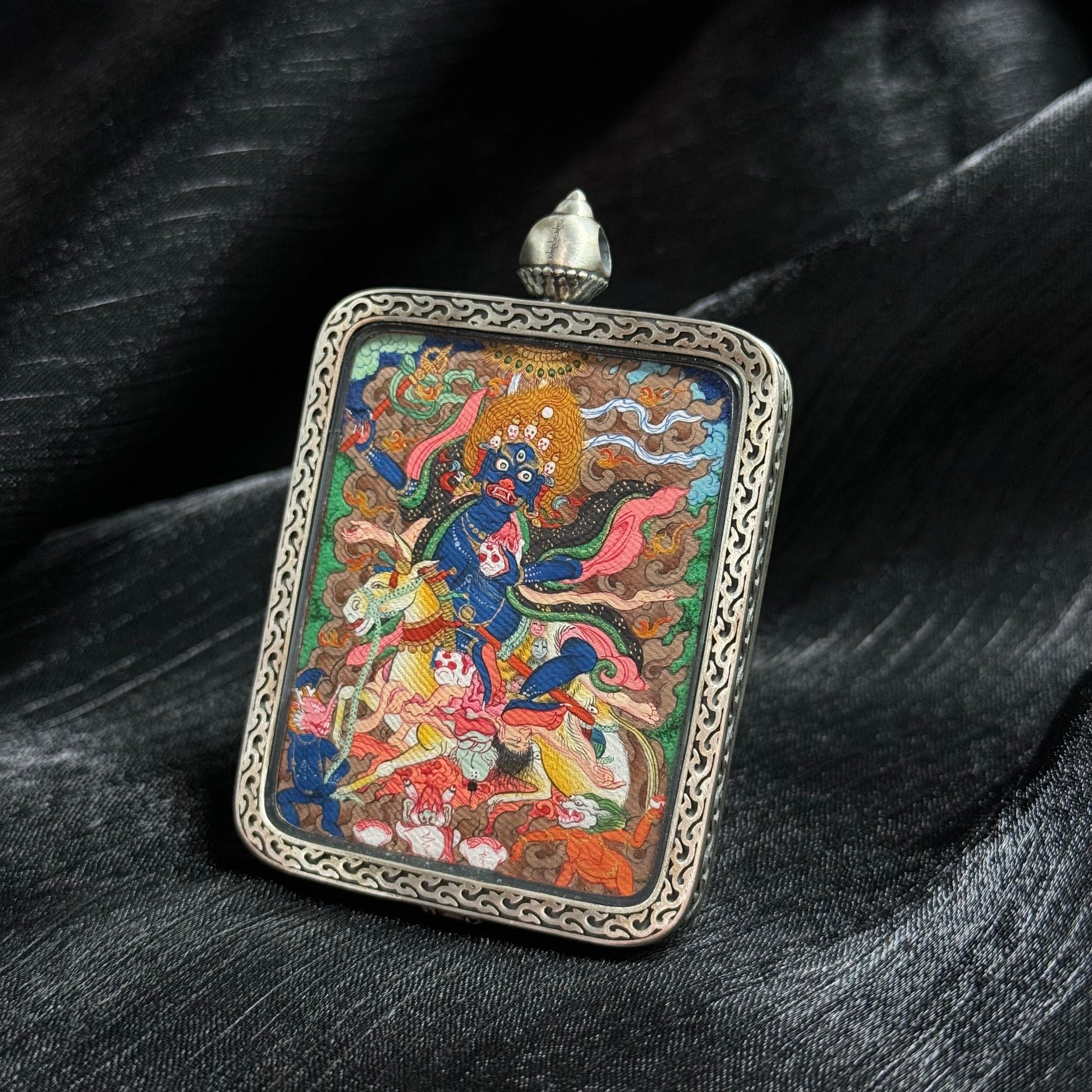  Close-up detail of the Tibet Mensar Palden Lhamo Thangka painting showing natural mineral pigments and gold.

