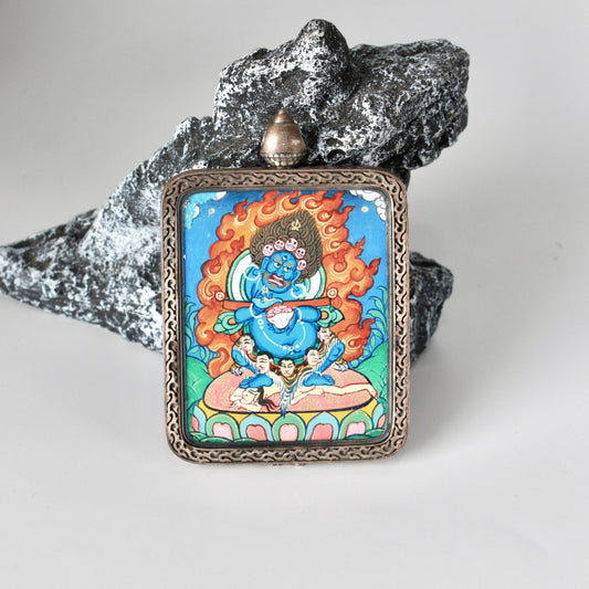 Close-up detail of the Rebgong Panjarnata Mahakala Thangka painting showing intricate natural mineral pigment work, showcasing the masterful artistry of Rebgong lineage painters.
