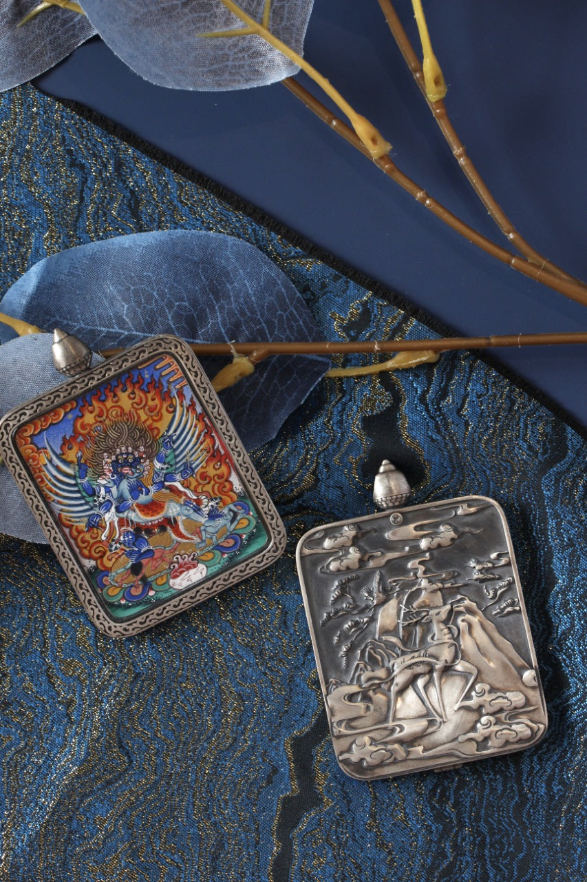 Tibetan Buddhist thangka pendant depicting Vajrakila, the Subduer Vajra deity, symbolizing spiritual power and removal of obstacles.