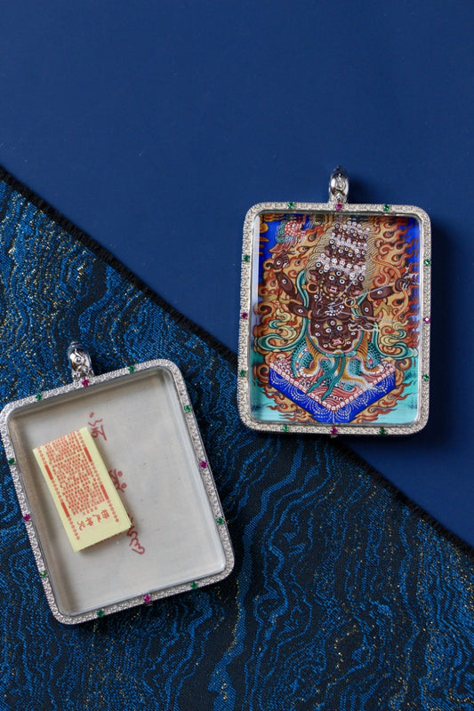 Rahula protector thangka pendant depicting the Tibetan Buddhist wrathful guardian deity associated with protection and the removal of obstacles.
