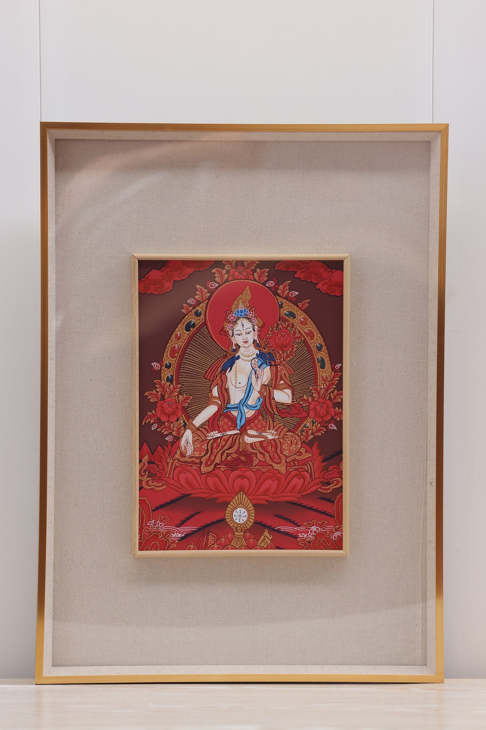 Red thangka of White Tara expressing compassion, longevity, and sacred blessings in Tibetan Buddhist culture