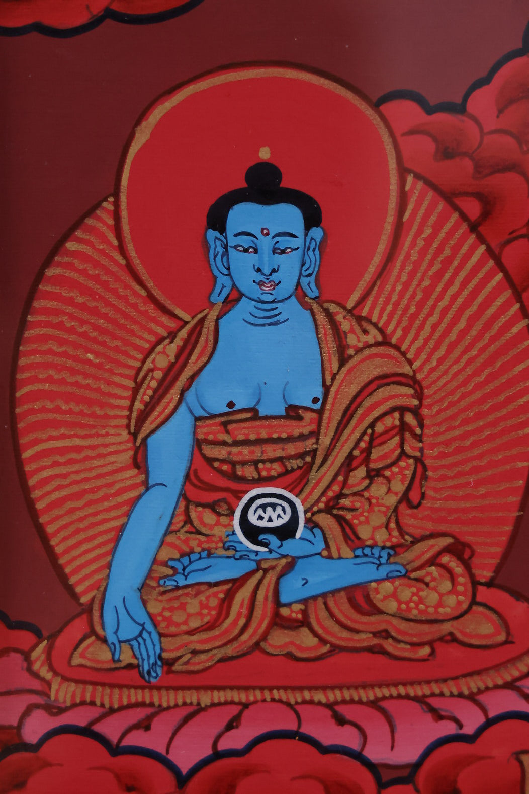 Red Shakyamuni Buddha surrounded by a sacred halo, symbolizing divine radiance and enlightenment.