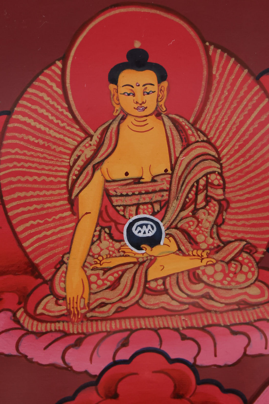 Red Shakyamuni Buddha set against a mandala background, showcasing cosmic and spiritual harmony.