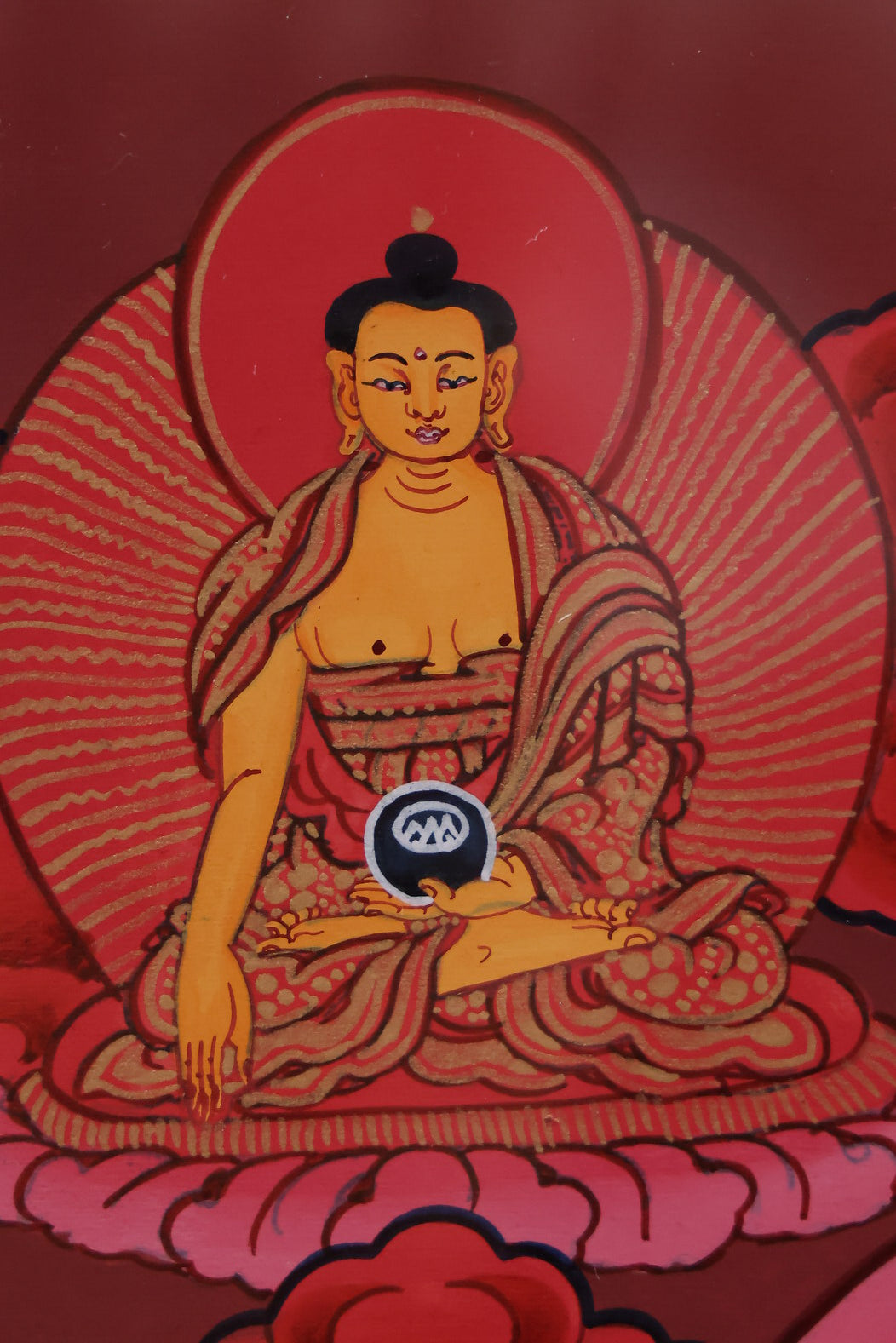 Red Shakyamuni Buddha with attendant bodhisattvas, reflecting sacred hierarchy and spiritual symbolism.