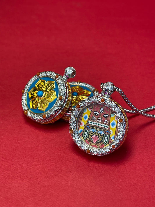 Hand-painted Nepal Red Shridevi (红扎基拉姆) Thangka pendant 2cm with jewellery copper casing featuring the female wealth deity, representing fortune and peace in Buddhist tradition.
