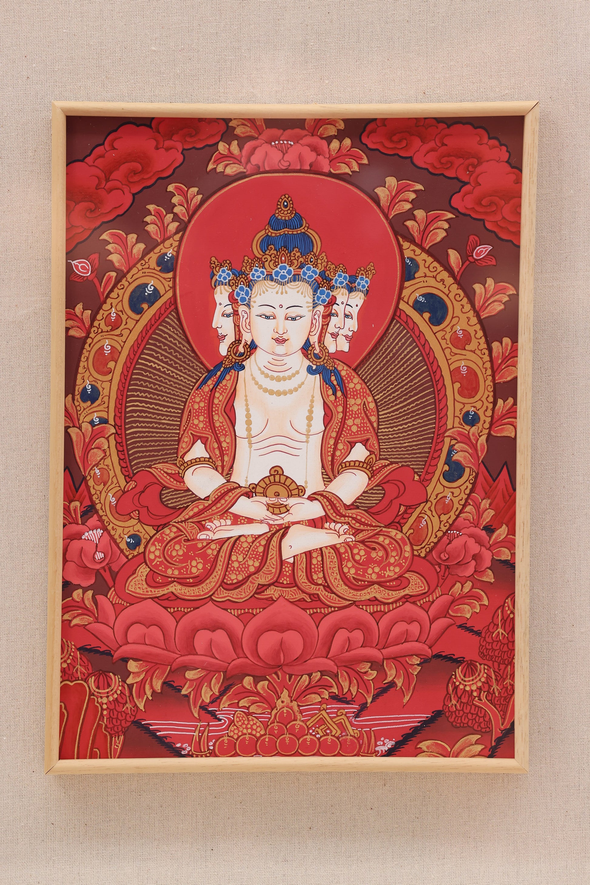 Red tantric thangka of Vairocana Buddha, central figure in Vajrayana Buddhism and embodiment of ultimate truth