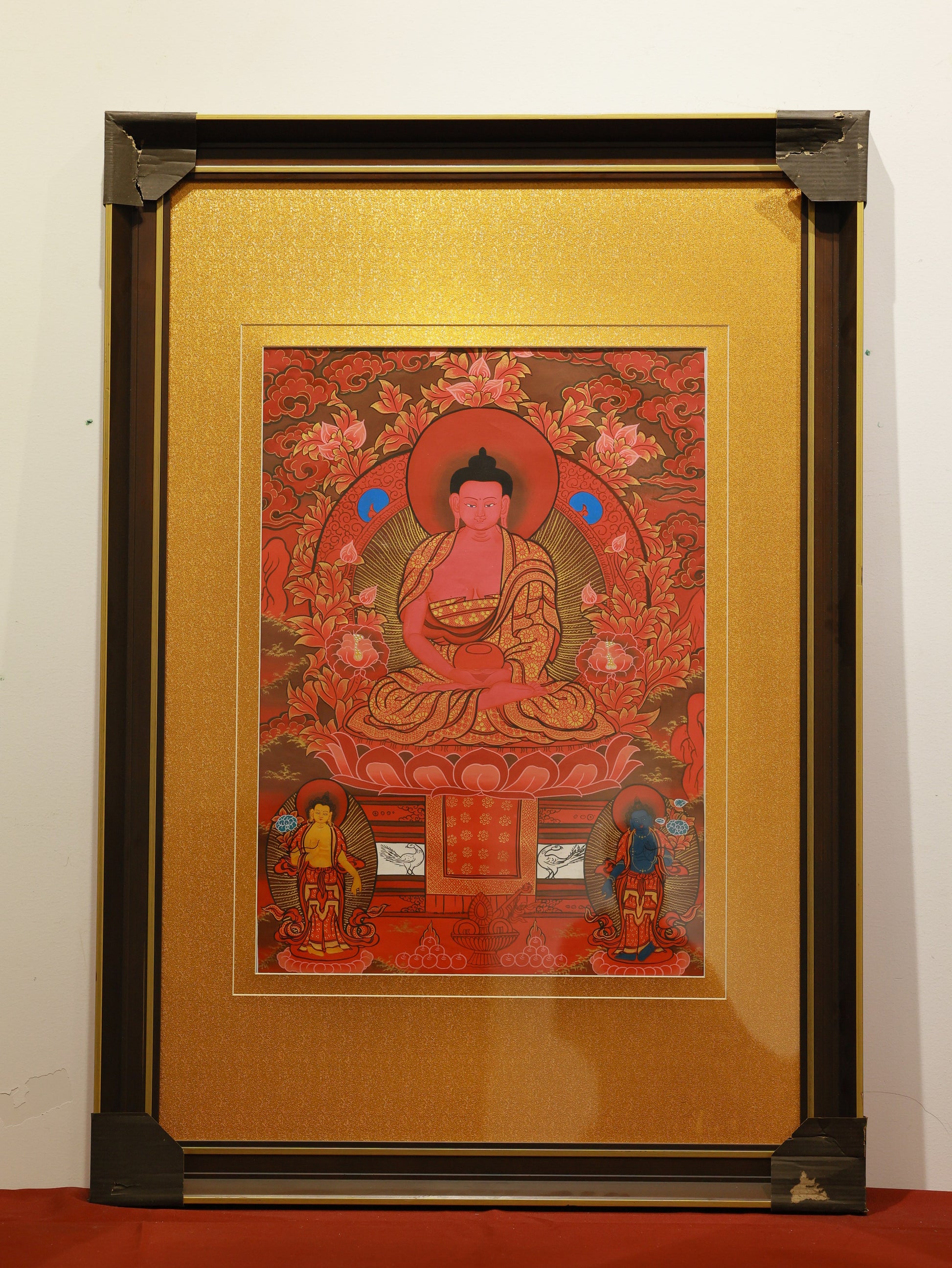 Traditional ritual Thangka painting of Amitabha Buddha in vibrant red colors.