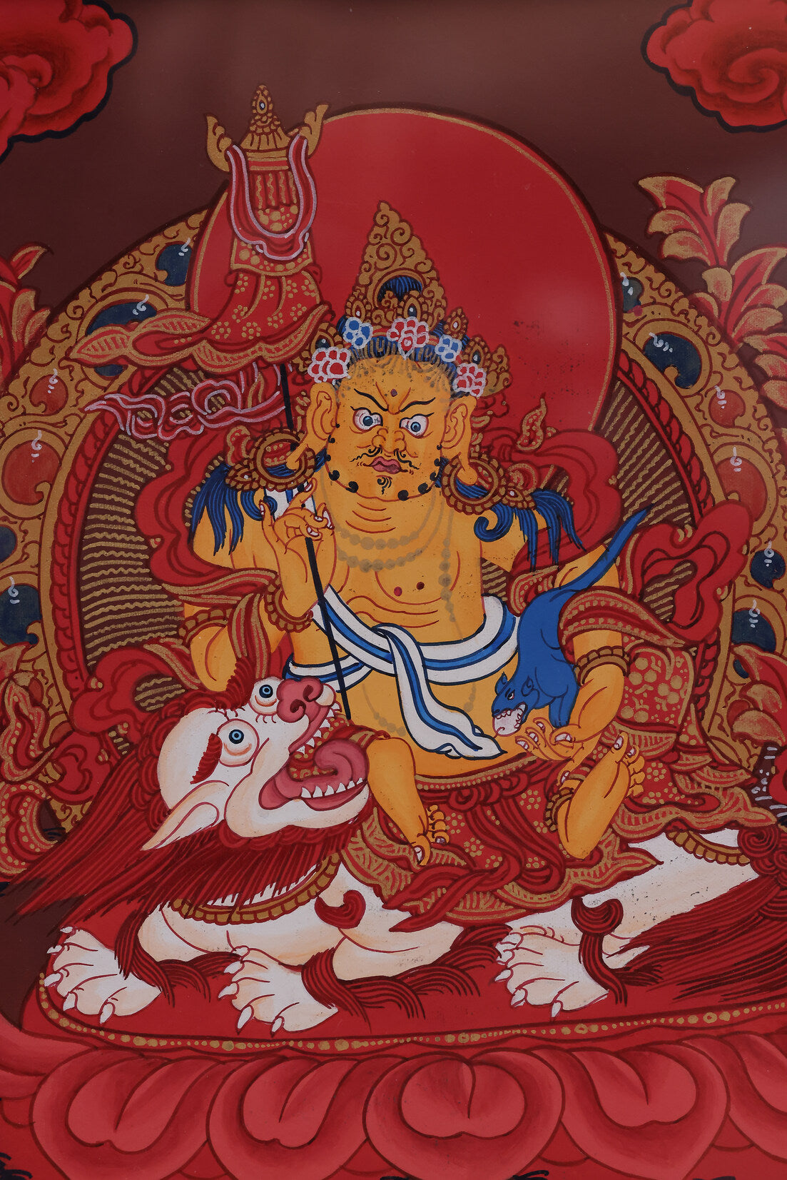 Alt: Hand-painted red Tibetan Thangka of the Treasure King deity, symbolizing wealth and prosperity.