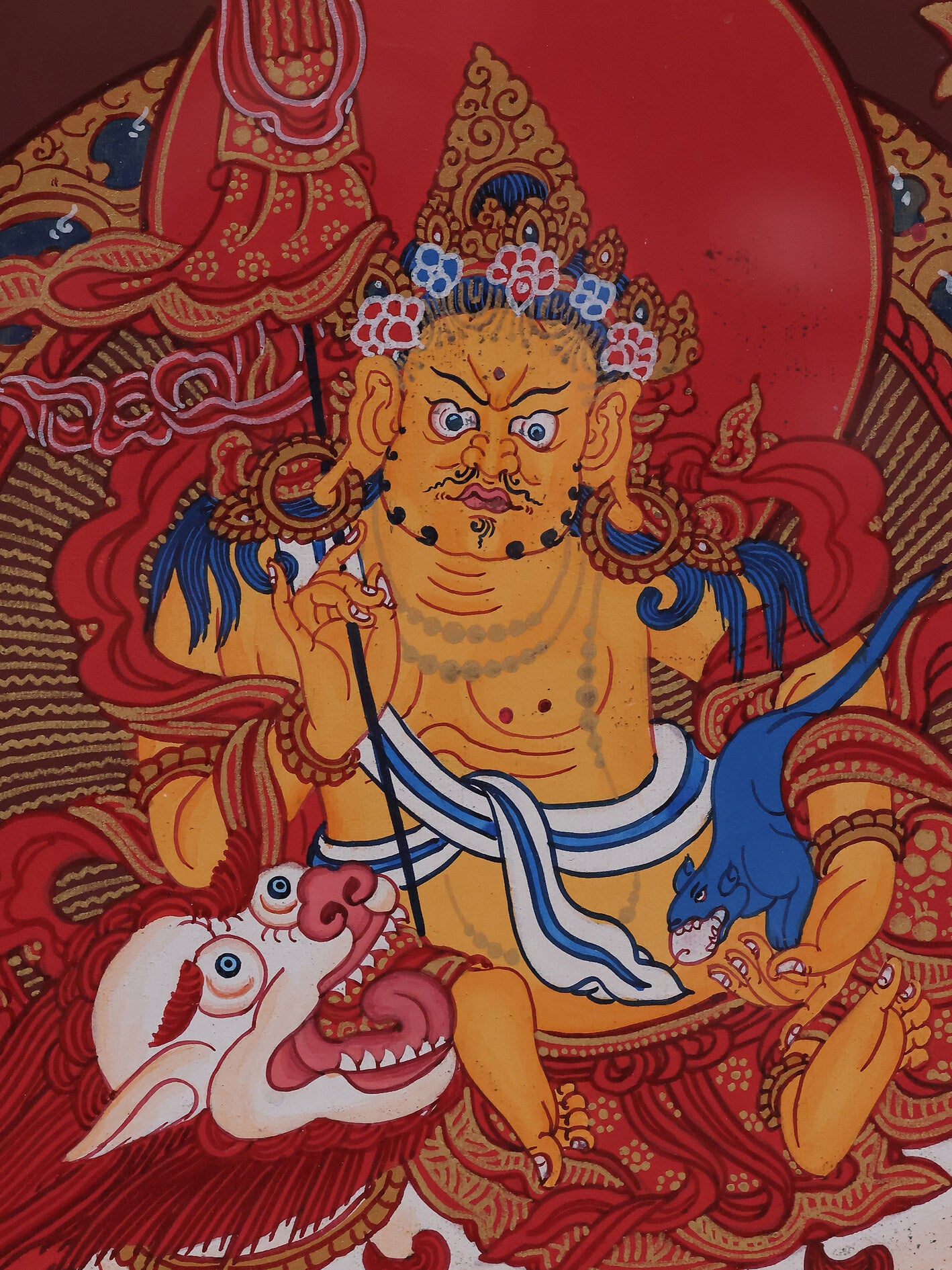 Alt: Red Tibetan Thangka showing the Buddhist wealth deity, blessing for abundance.