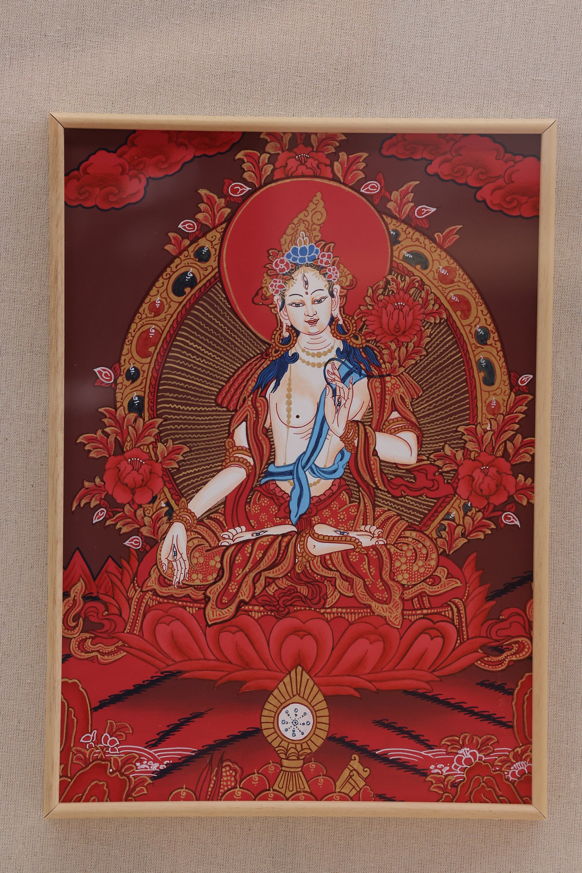 Red thangka artwork of White Tara used for healing meditation and spiritual protection in Tibetan Buddhism